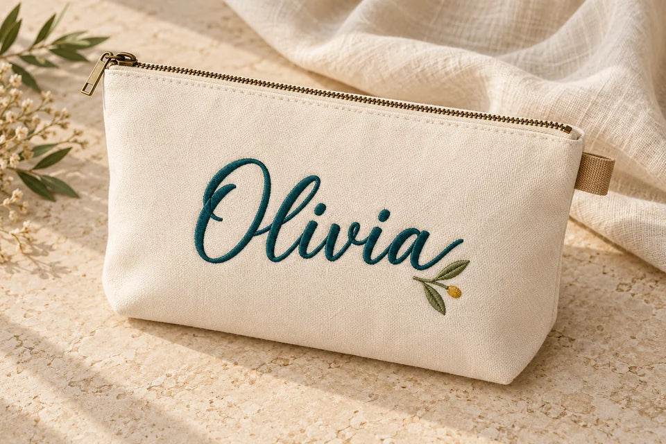 Pouch personalized with Olivia script embroidery.